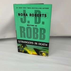 Book Strangers in Death by JD Robb hardback.  B142